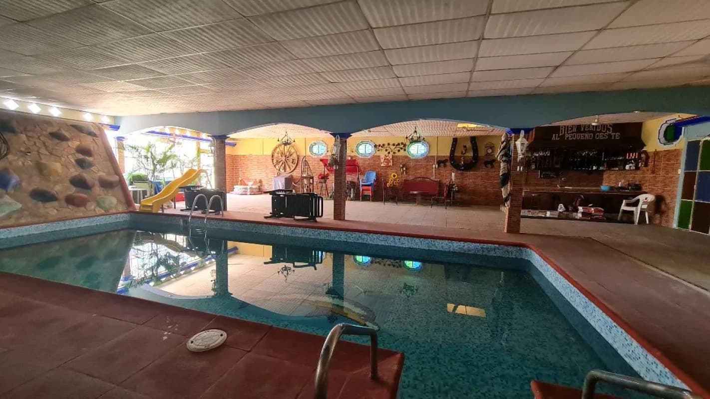 CASA VACACIONAL EN VENTA EN QUINTAS LA PONDEROSA, KM 77 HACIA PUERTO QUETZAL